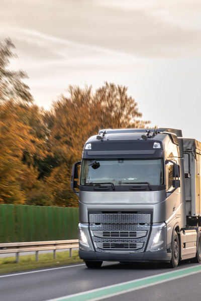 bb-koda-95/modern-semi-truck-autumn-highway-sunset-long-haul-freight