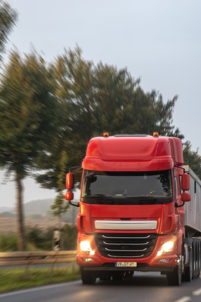 training-and-certifications/red-semi-rural-highway-with-headlights-morning-delivery